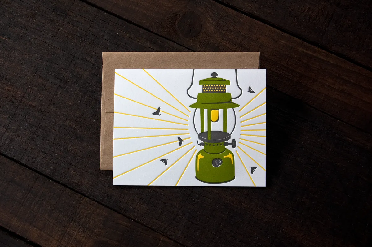 Letterpress greeting card with a camp lantern illustration printed on cotton paper