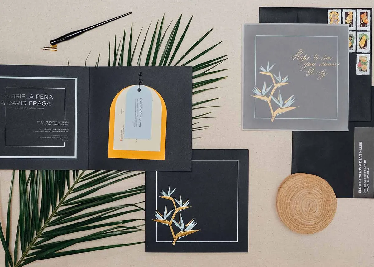 Foil stamped and letterpress folio bird of paradise wedding suite