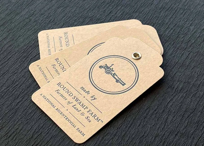 Letterpress hang tags on kraft with eyelets