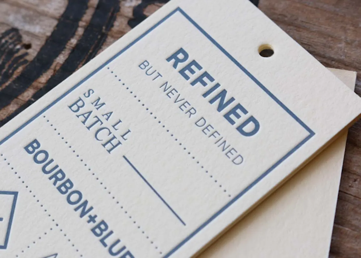Letterpress hang tag showing space for handwritten batch number on 220lb cotton paper