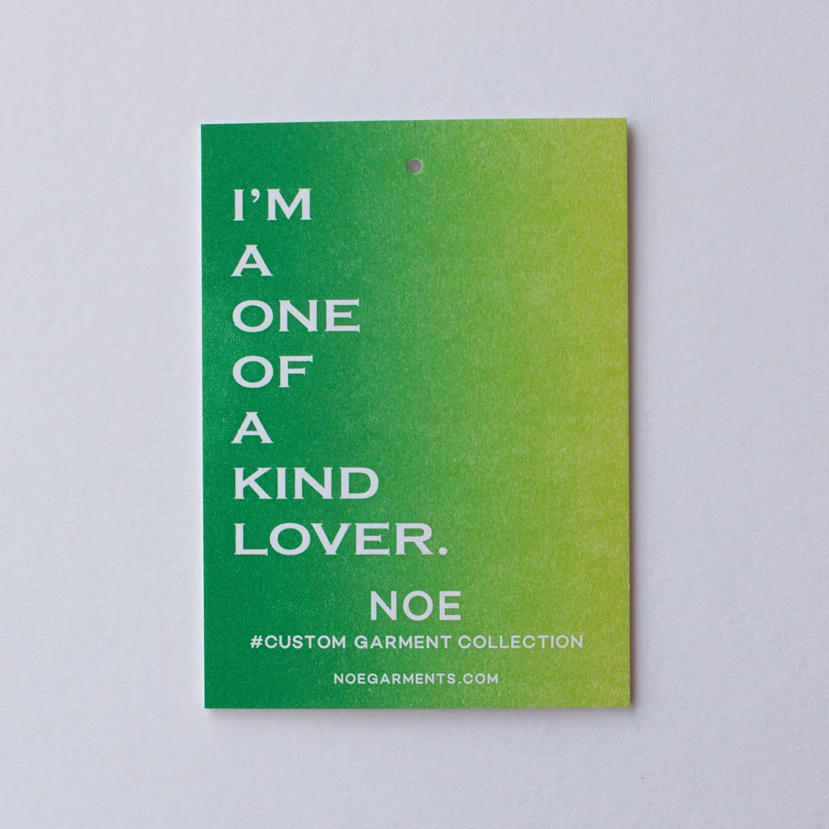 Single hang tag with a green-to-yellow split fountain gradient showing the soft blend between ink colors